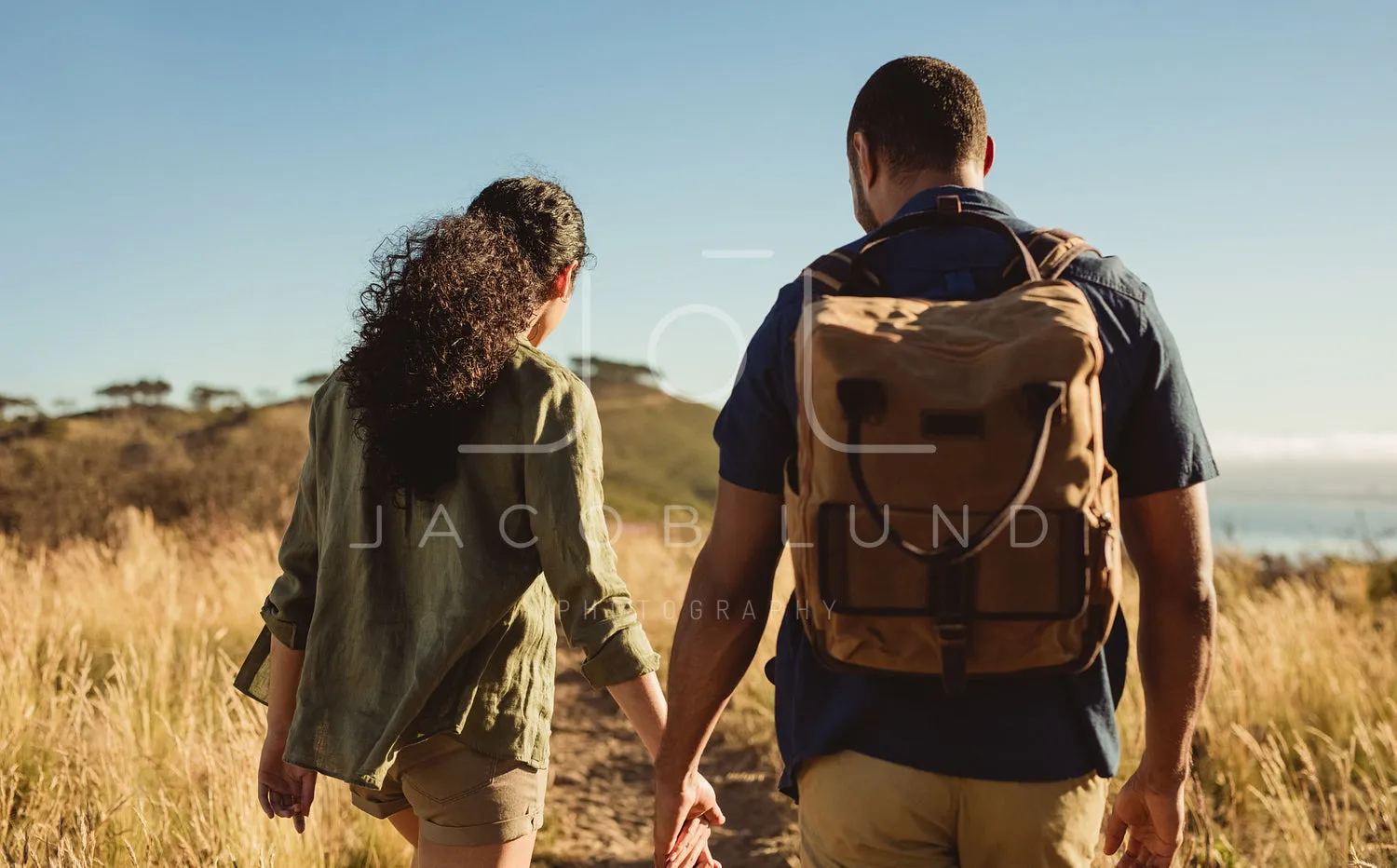 Couple walking on a hill